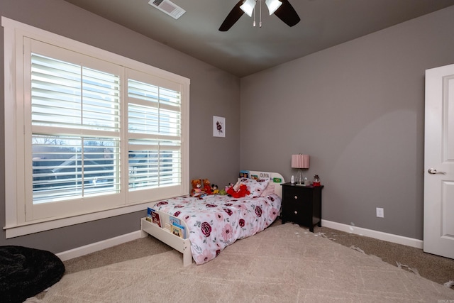 carpeted bedroom featuring ceiling fan