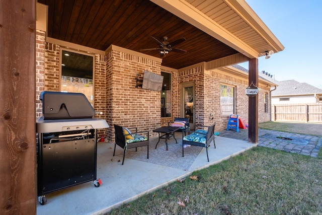 view of patio / terrace with ceiling fan, a grill, and an outdoor hangout area