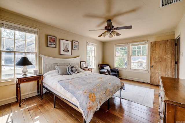 bedroom featuring hardwood / wood-style floors and ceiling fan