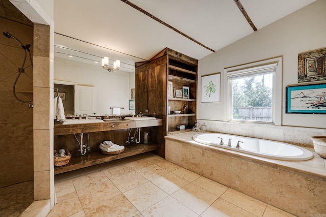 bathroom featuring tile patterned floors, vanity, lofted ceiling, and independent shower and bath