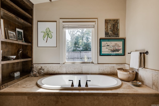 bathroom featuring a relaxing tiled tub