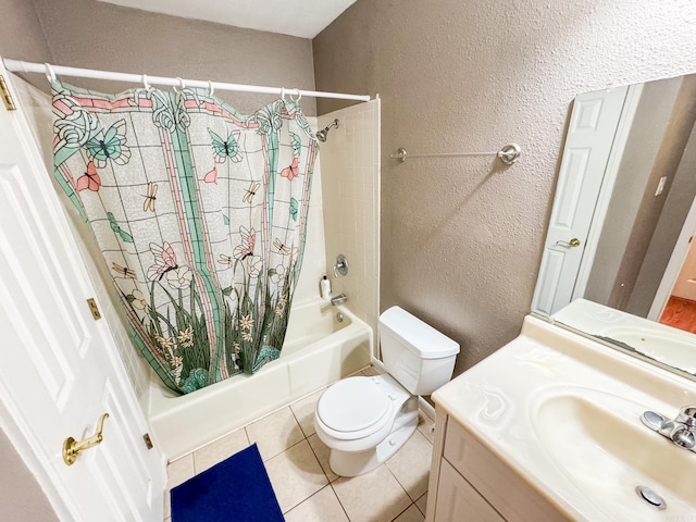 full bathroom featuring tile patterned flooring, toilet, vanity, and shower / tub combo with curtain