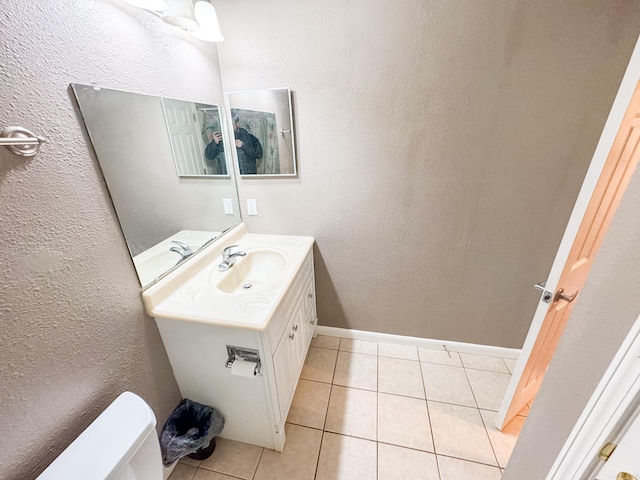 bathroom featuring vanity, toilet, and tile patterned floors