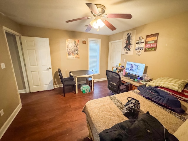 bedroom featuring ceiling fan and dark hardwood / wood-style floors