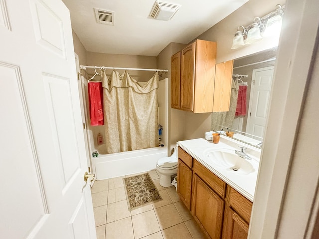 full bathroom featuring toilet, tile patterned floors, vanity, and shower / bathtub combination with curtain