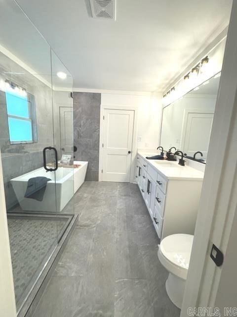 full bathroom featuring shower with separate bathtub, vanity, and toilet