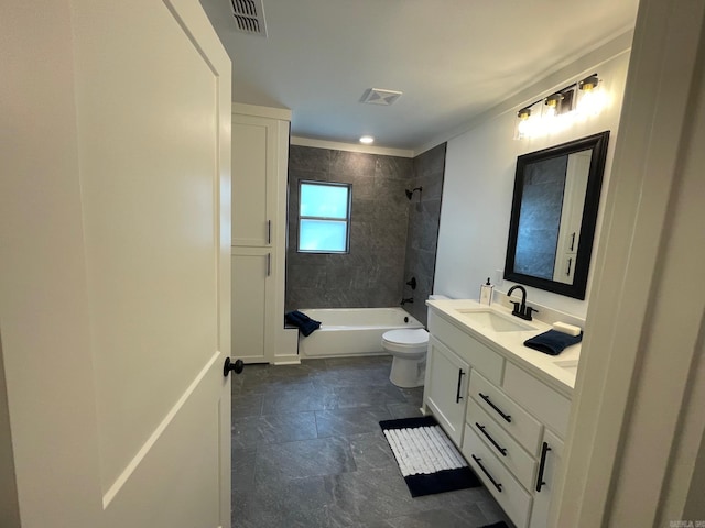 full bathroom featuring tiled shower / bath combo, toilet, and vanity