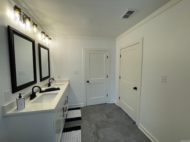 bathroom with vanity and ornamental molding