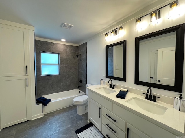 full bathroom featuring vanity, toilet, and tiled shower / bath