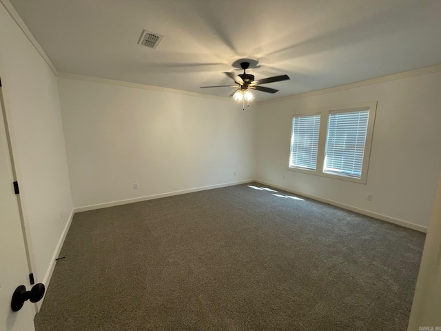 carpeted empty room featuring ceiling fan and crown molding