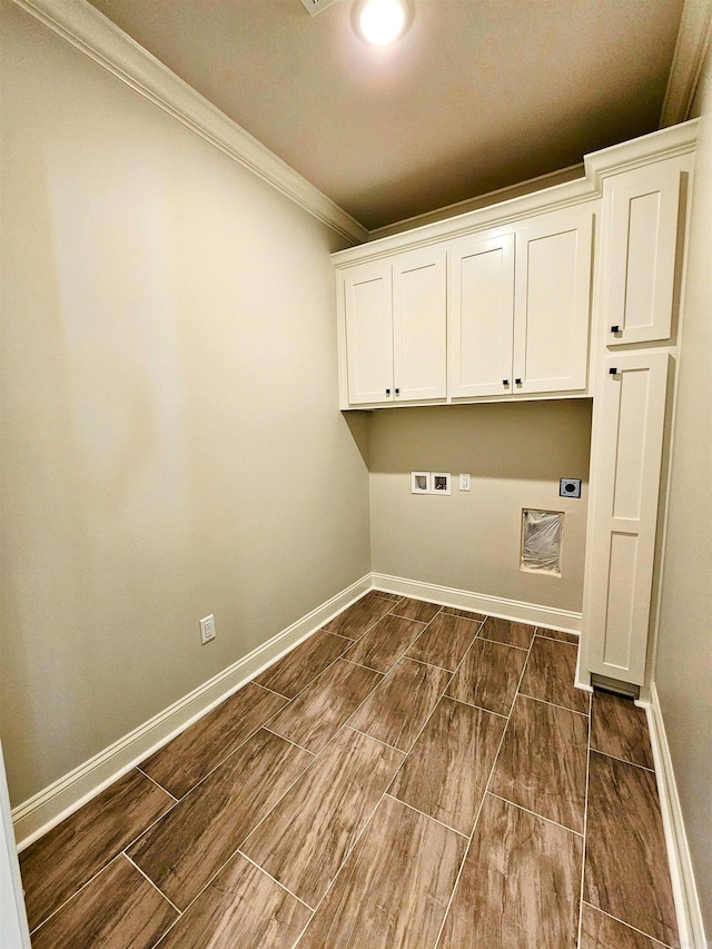 laundry room with cabinets, washer hookup, ornamental molding, and electric dryer hookup