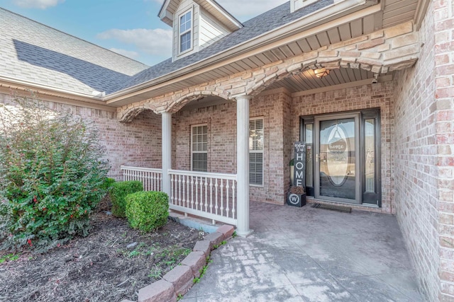 doorway to property featuring a porch