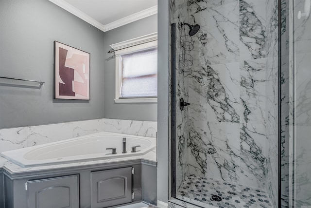 bathroom featuring ornamental molding and shower with separate bathtub