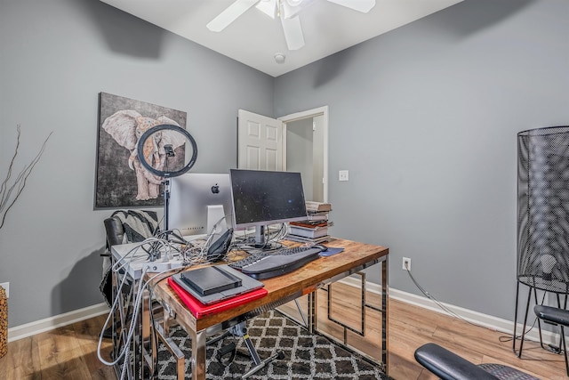 office with hardwood / wood-style flooring and ceiling fan