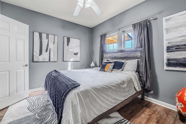 bedroom with ceiling fan and hardwood / wood-style floors