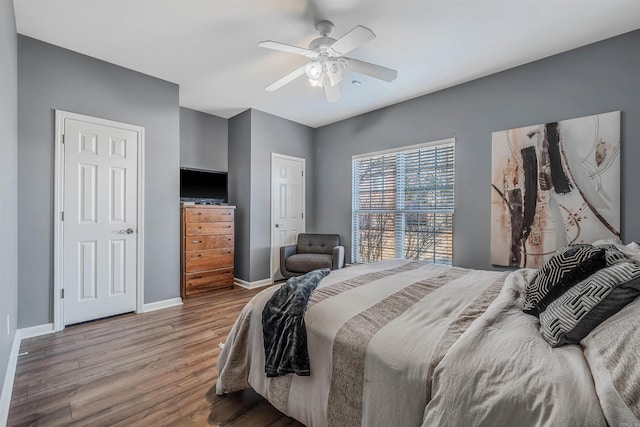 bedroom with ceiling fan and wood-type flooring