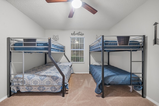 bedroom with carpet flooring, a textured ceiling, and ceiling fan