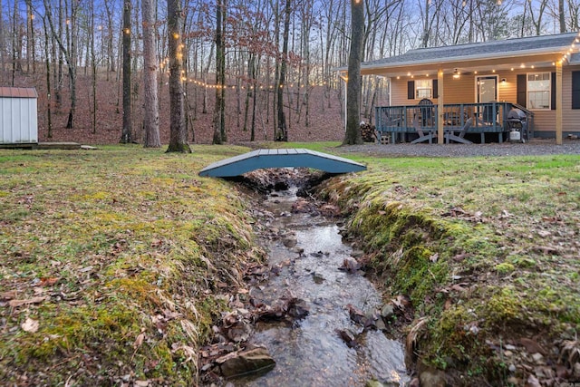 view of yard with a wooden deck