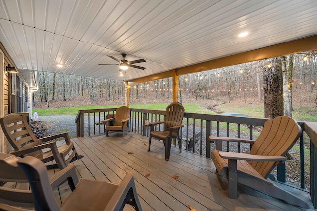 wooden deck featuring ceiling fan