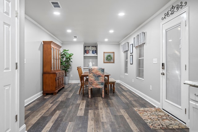 dining area featuring dark hardwood / wood-style floors and ornamental molding