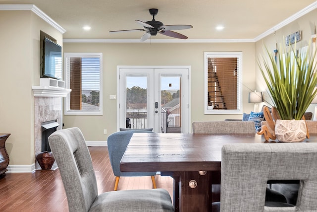 dining area featuring french doors, dark hardwood / wood-style flooring, ceiling fan, and ornamental molding