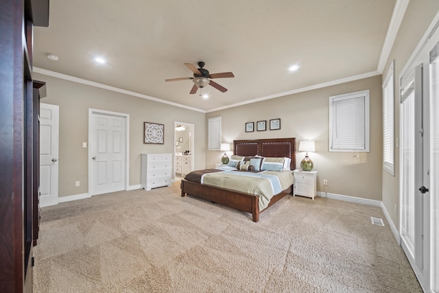 carpeted bedroom with ceiling fan and ornamental molding