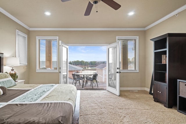 carpeted bedroom with access to outside, multiple windows, ceiling fan, and crown molding