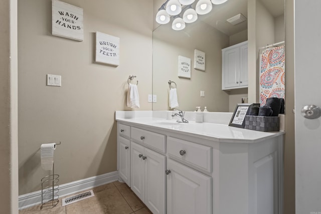 bathroom with tile patterned flooring and vanity