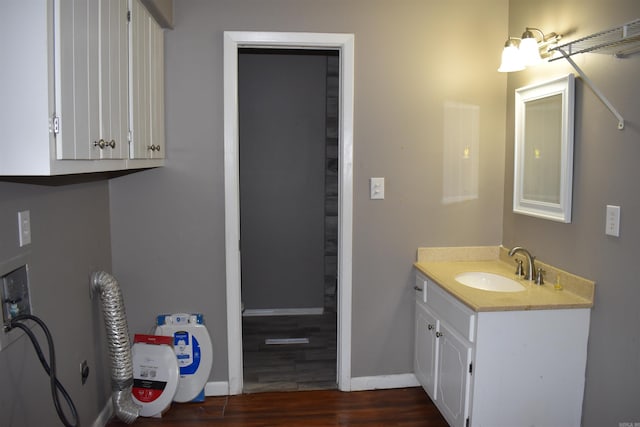 bathroom featuring vanity and wood-type flooring