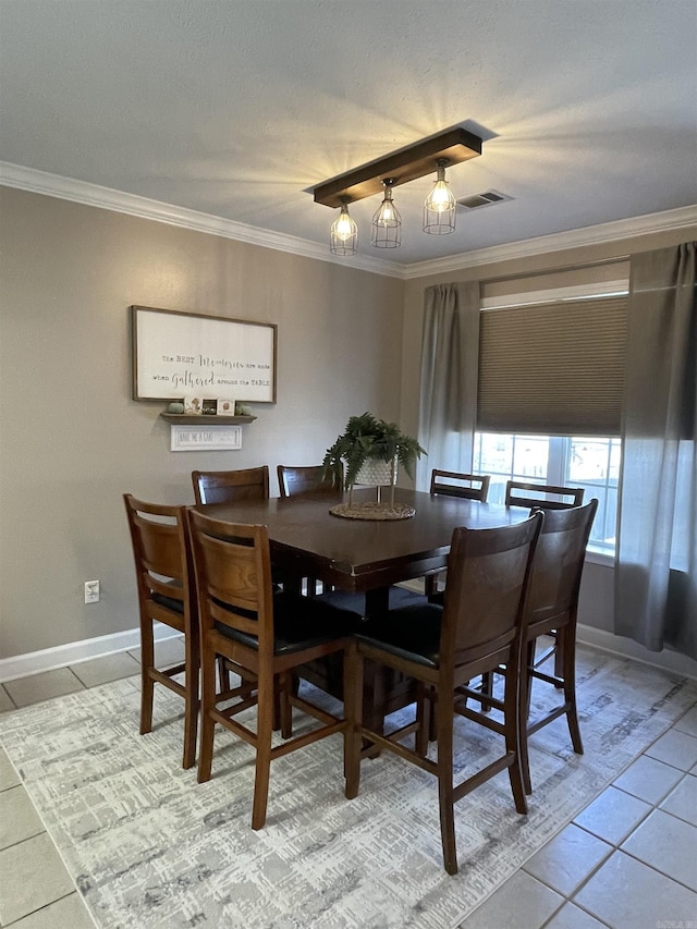 tiled dining area with crown molding