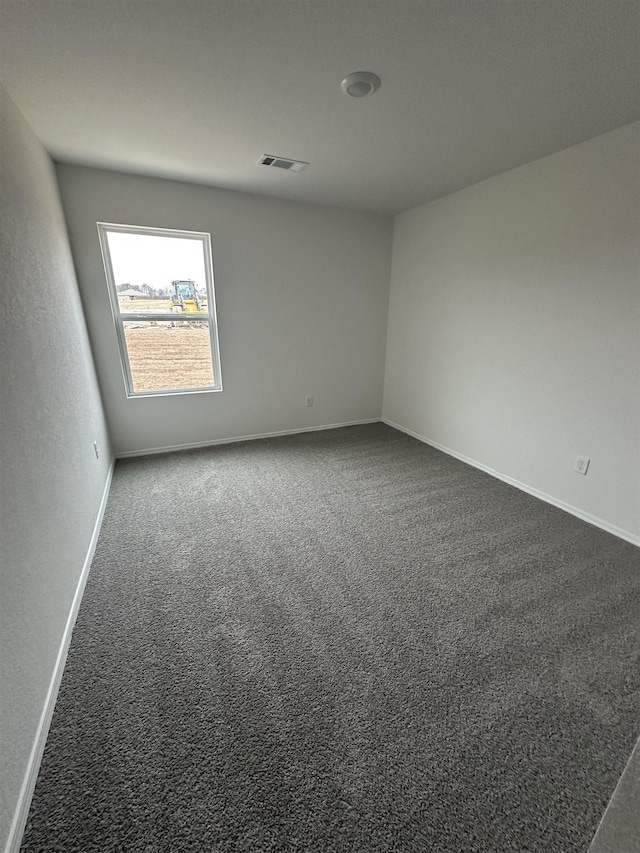 empty room with carpet flooring