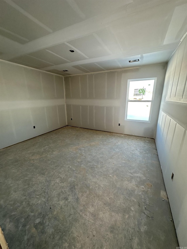 spare room featuring concrete flooring