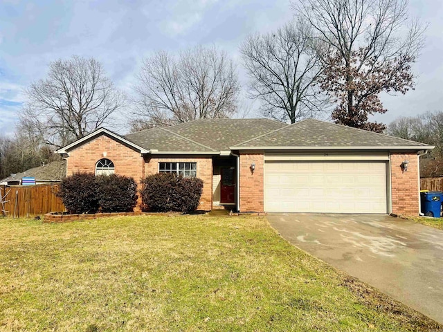 single story home featuring a garage and a front lawn