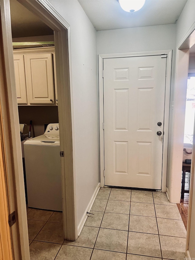 interior space featuring light tile patterned floors and washer / clothes dryer