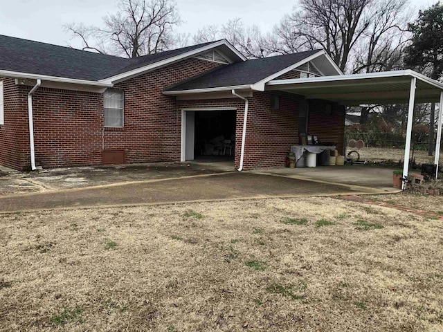 view of side of property featuring a carport and a garage