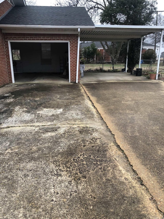 view of vehicle parking featuring a garage