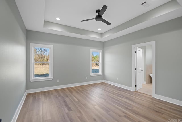 unfurnished room with ceiling fan, plenty of natural light, and light hardwood / wood-style flooring