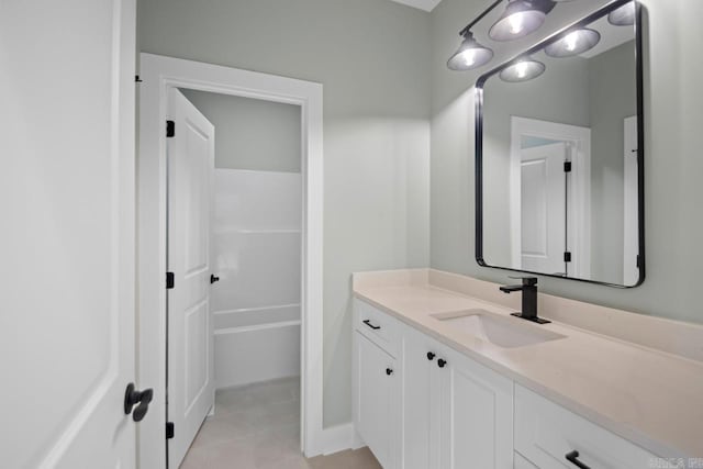 bathroom with tile patterned floors and vanity