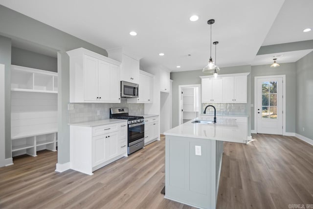 kitchen featuring sink, white cabinets, and stainless steel appliances