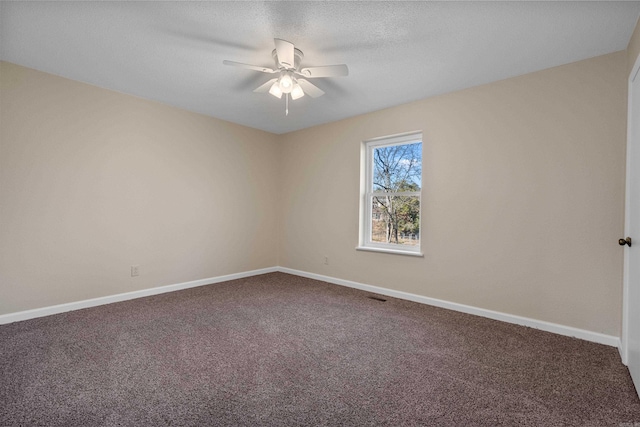 empty room with carpet flooring and ceiling fan