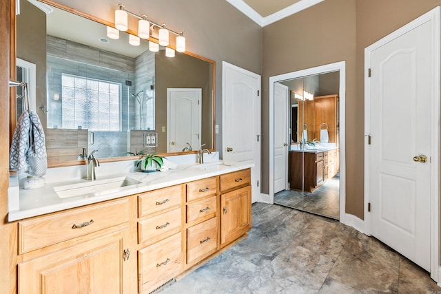 bathroom with vanity, an enclosed shower, and ornamental molding