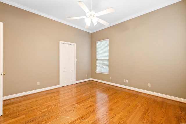 unfurnished room featuring ceiling fan, light hardwood / wood-style floors, and ornamental molding