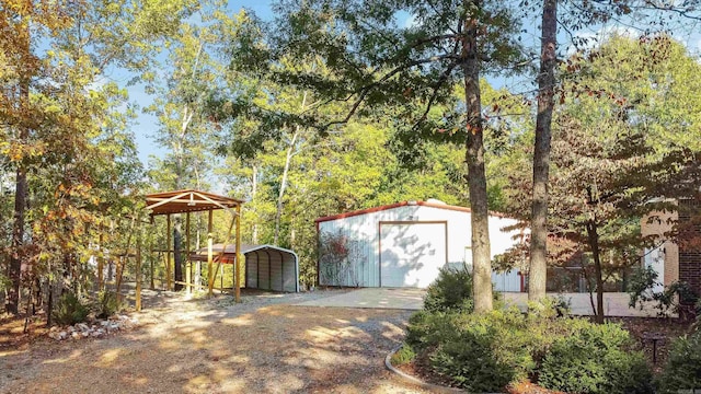 view of outbuilding with a carport