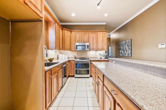 kitchen with light stone countertops, stainless steel appliances, decorative backsplash, light tile patterned flooring, and ornamental molding