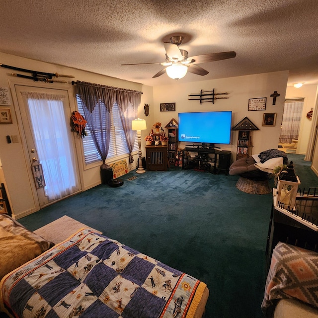 carpeted living room featuring ceiling fan and a textured ceiling