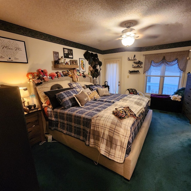 bedroom with carpet, a textured ceiling, and ceiling fan