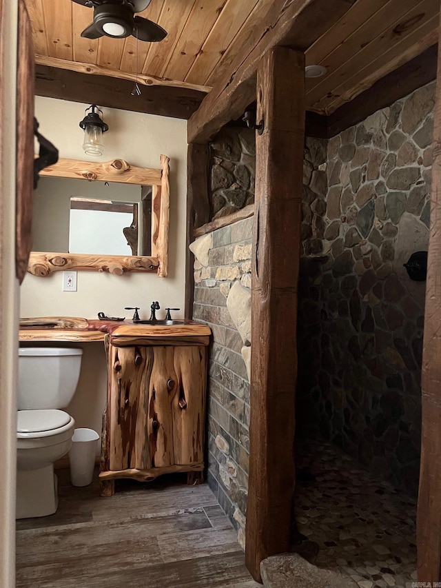 bathroom with ceiling fan, wooden ceiling, a shower, wood-type flooring, and toilet