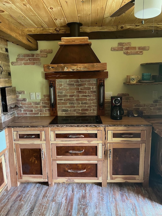 kitchen with hardwood / wood-style floors, black electric stovetop, ceiling fan, wood ceiling, and extractor fan