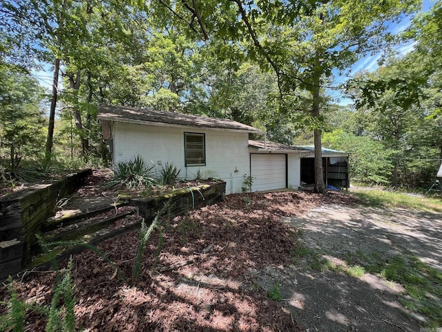 view of property exterior featuring a garage