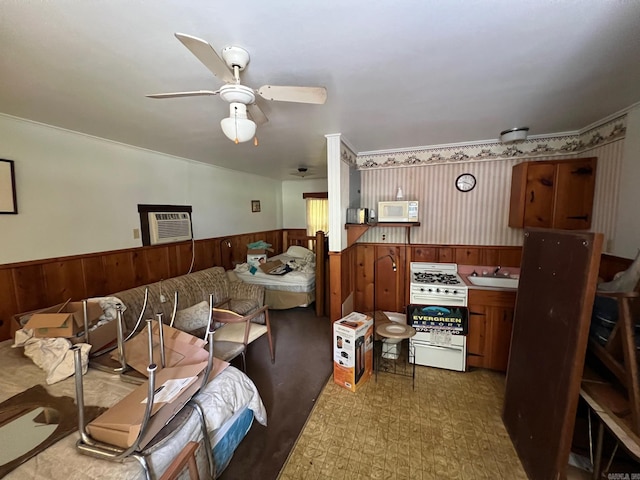 living room with ceiling fan and sink